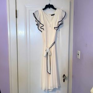 Beautiful cream and navy blue Lauren by Ralph Lauren’s woman’s dress size 6.